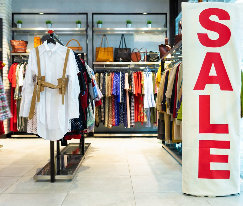 Beautiful girl chooses shoes in the store
