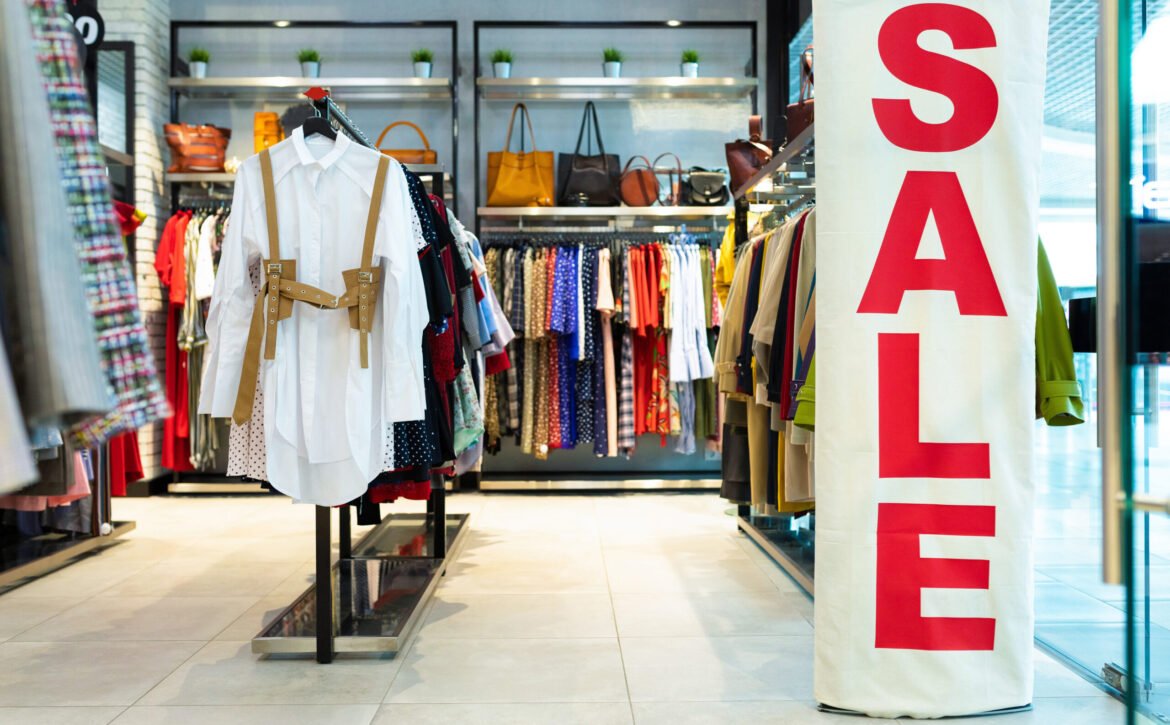Beautiful girl chooses shoes in the store