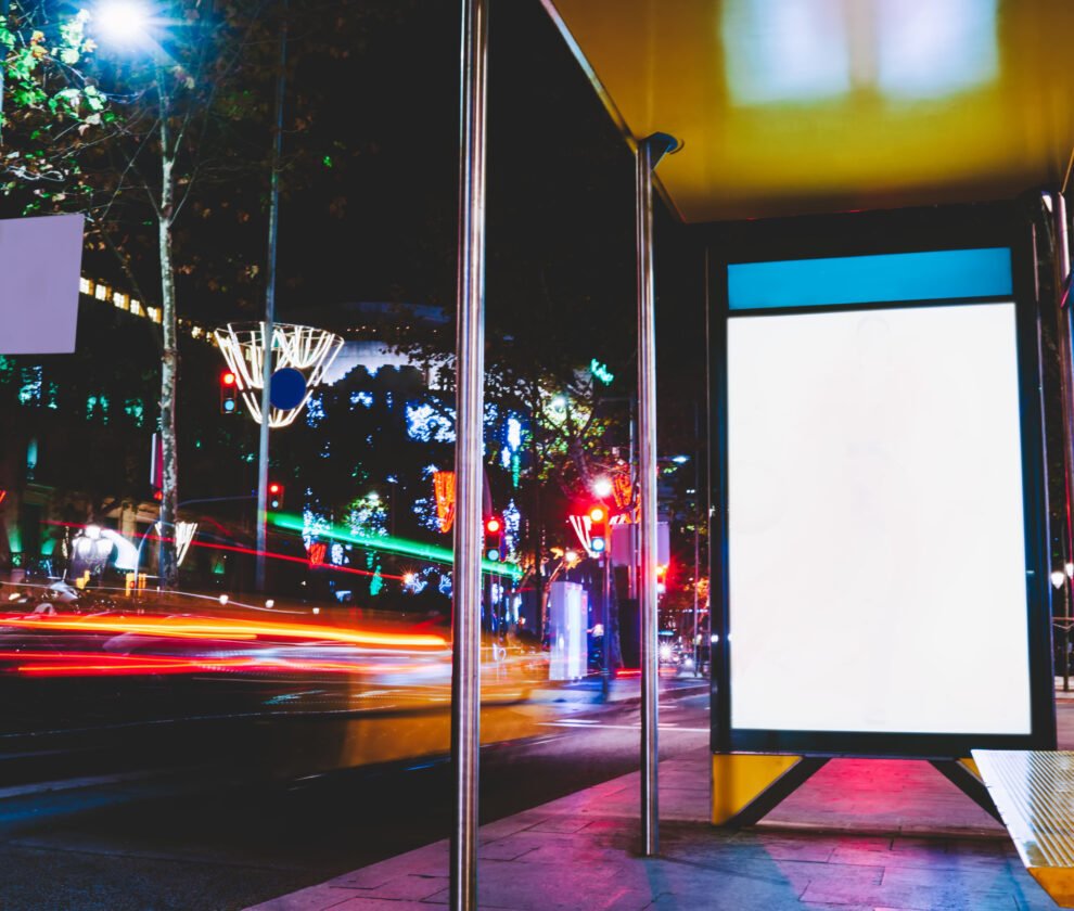 Modern bus stop with banner in street