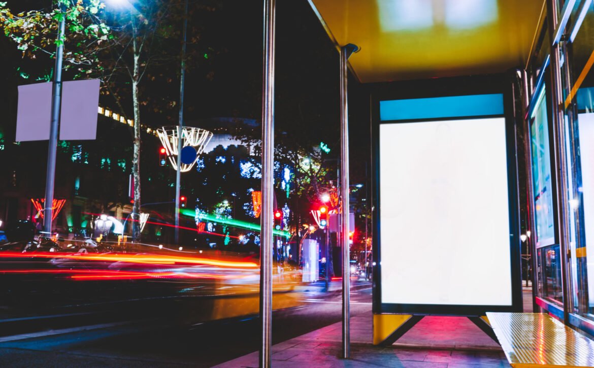 Modern bus stop with banner in street